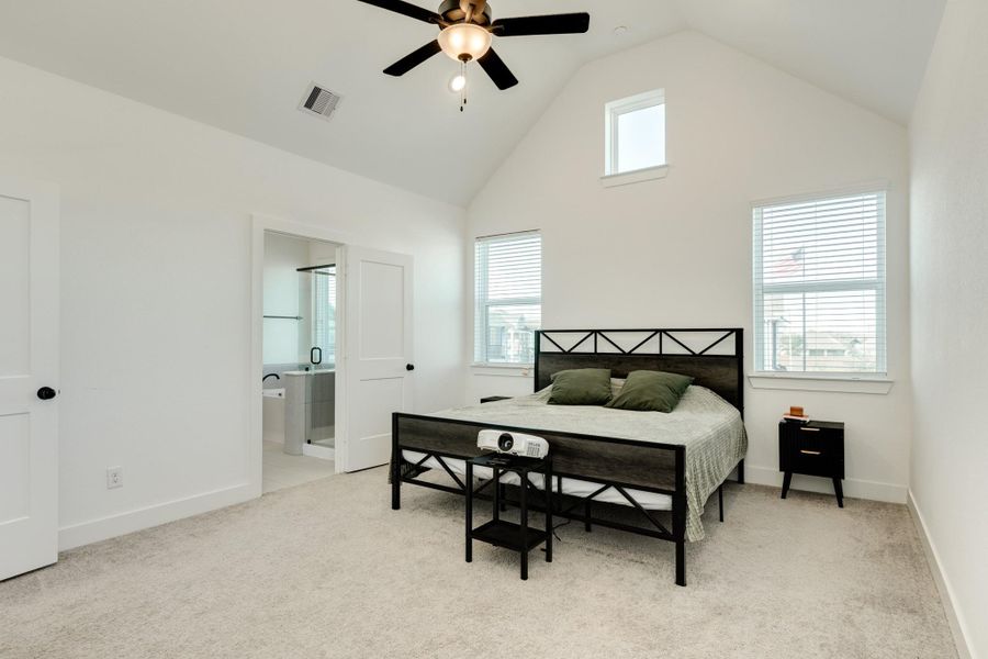 From this perspective of the primary suite, the entrance to the primary bath is visible.