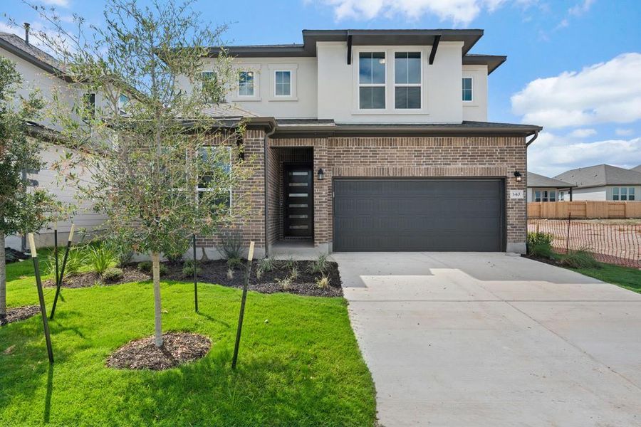 Front exterior of a new home in Arbor Collection At Park Central, Georgetown, TX, highlighting curb appeal (Image 18).