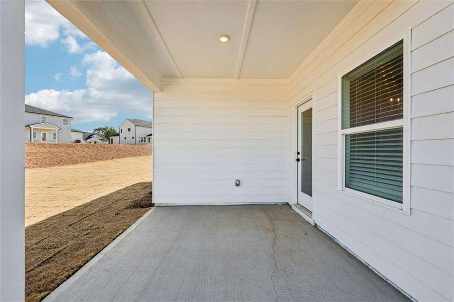 Exterior details and patio area of a home in River Pointe, Monroe (Image 4).