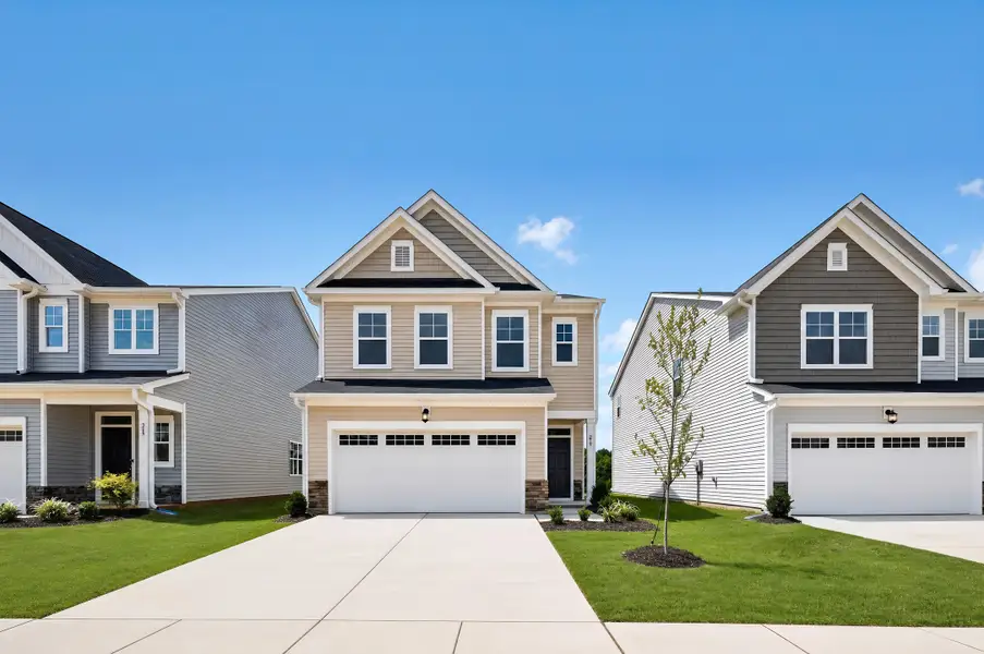 Front exterior of a new home in Caitlin Crossing, Lillington, NC, highlighting curb appeal (Image 1). Front exterior of a new home in Caitlin Crossing, Lillington, NC, highlighting curb appeal (Image 1).