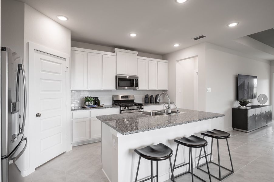 Representative furnished interior of a home built from the Caddo by Tri Pointe Homes in Mason Woods, Cypress (Image 47).