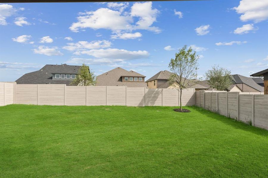 Exterior details and patio area of a home in Painted Tree Woodland West, McKinney (Image 26).
