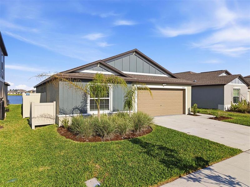 Front exterior of a new home in North Park Isle, Plant City, FL, highlighting curb appeal (Image 24).