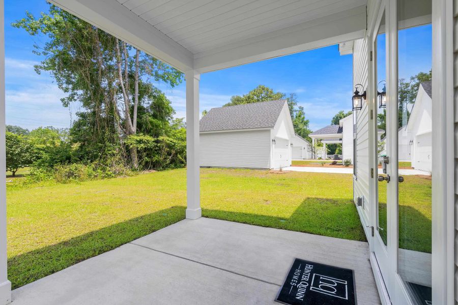 Exterior details and patio area of a home in Downtown Loris Homes, Loris (Image 25).