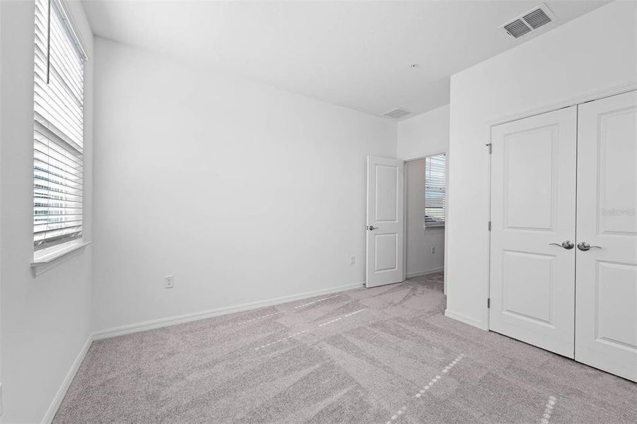 Spacious, unfurnished interior of a new home in Brack Ranch, St. Cloud (Image 24).