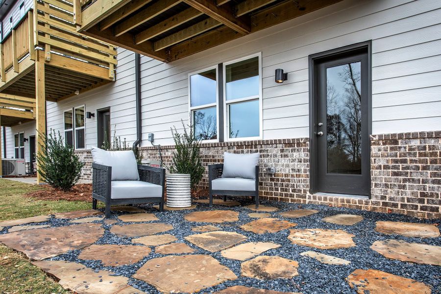 Exterior details and patio area of a home in Towne Village at Suwanee Dam, Sugar Hill (Image 3).