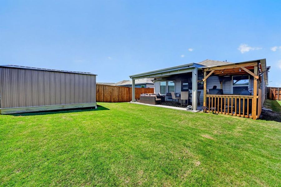 Exterior details and patio area of a home in Walden Pond, Forney (Image 23).