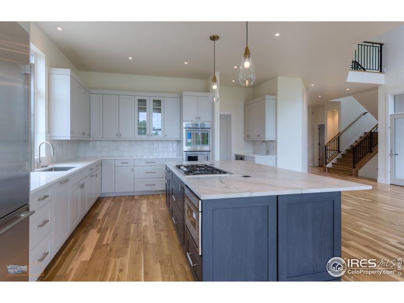 Kitchen Features Include Thermador SS Appliances: Gas Cooktop, Downdraft Vent, Drawer Microwave, Built In Refrigerator, Double Wall Oven, And Dishwasher