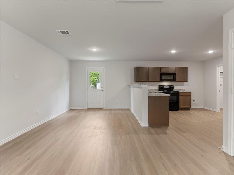 Spacious dining area seamlessly connected to the kitchen, perfect for entertaining.