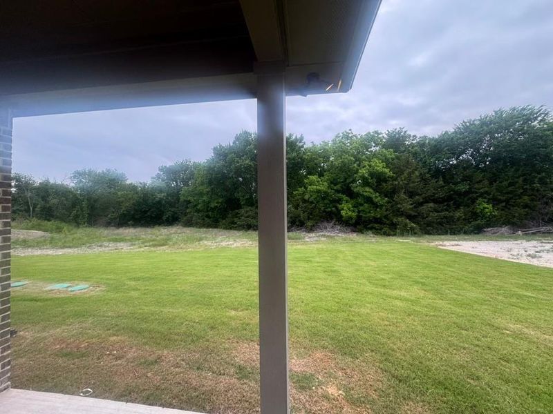 Exterior details and patio area of a home in King Crossing Estates, Van Alstyne (Image 14).
