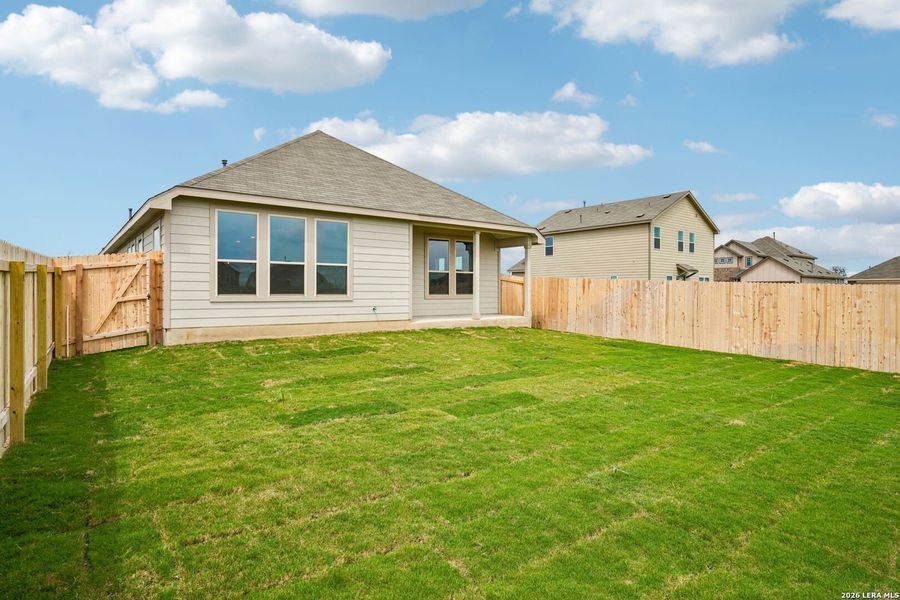 Exterior details and patio area of a home in Prairie Green, Converse (Image 18).