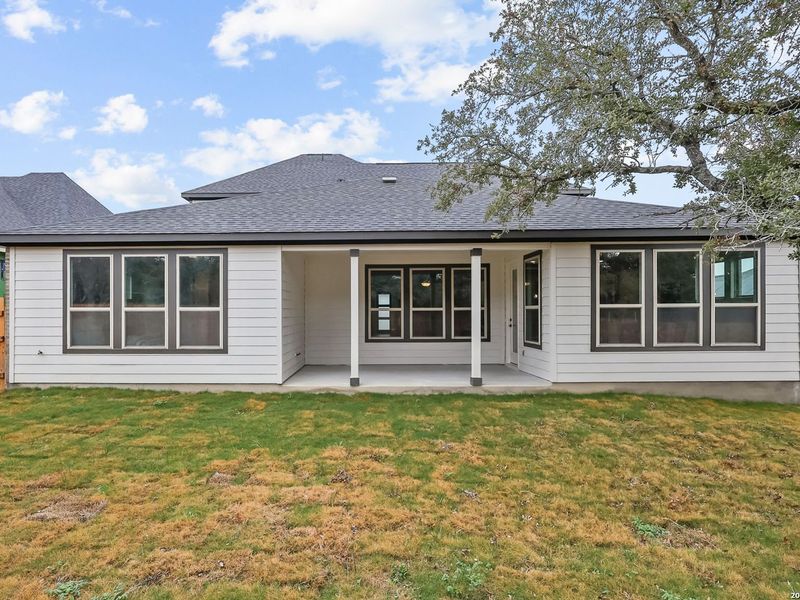 Exterior details and patio area of a home in The Reserve at Potranco Oaks, Castroville (Image 4).