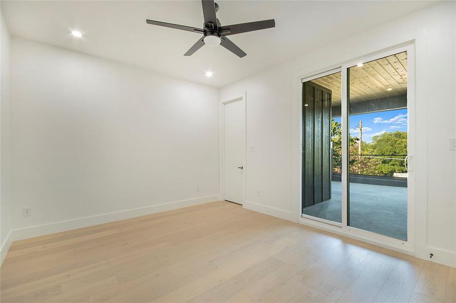 Spare room featuring light wood-style floors, ceiling fan, and recessed lighting Spare room featuring light wood-style floors, ceiling fan, and recessed lighting