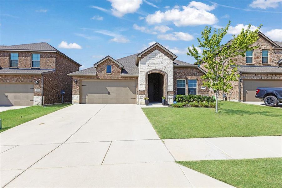 Front exterior of a new home in , Aubrey, TX, highlighting curb appeal (Image 19).