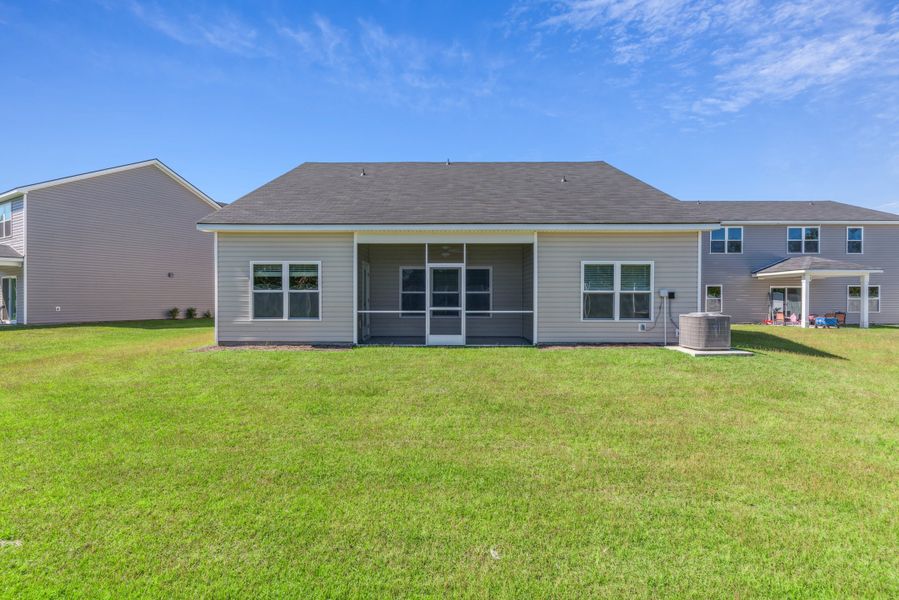 Exterior details and patio area of a home in Woodland Cove, Brunswick (Image 3).