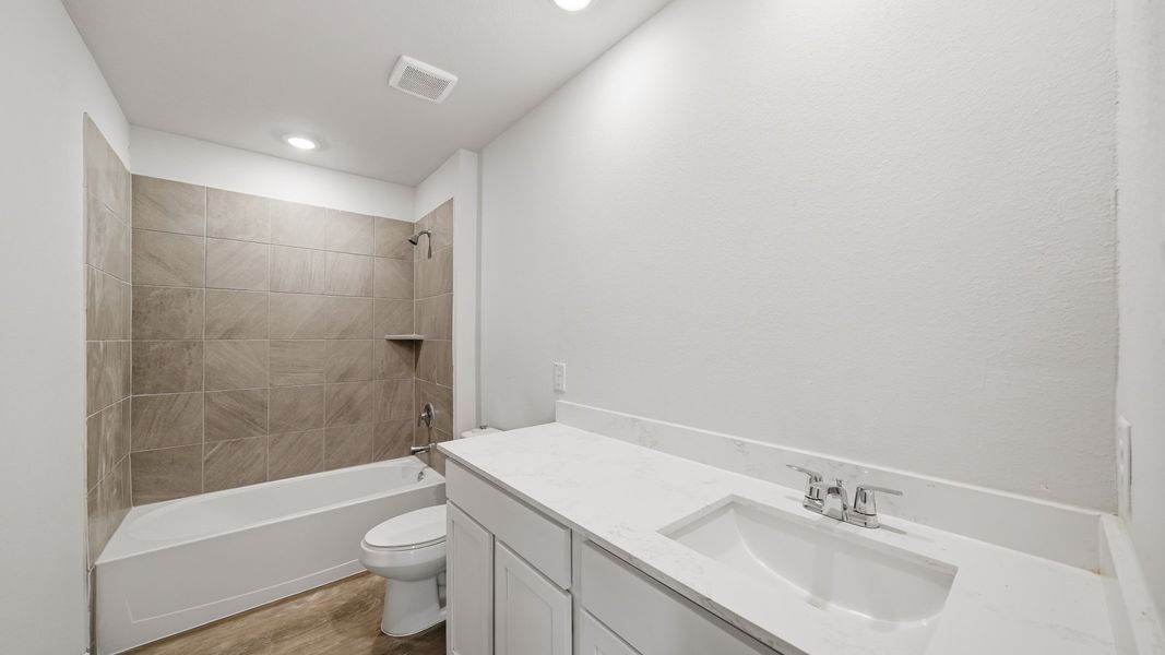 Furnished interior view inside a new home in Sunterra Lakes, Brookshire (Image 7).
