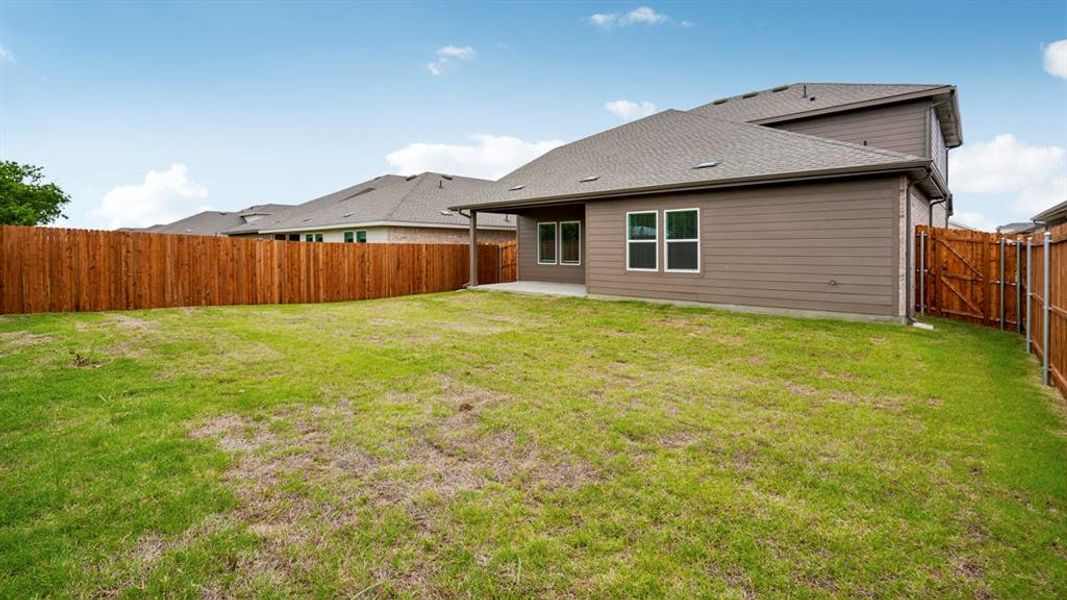 Exterior details and patio area of a home in Frontier Pointe, Princeton (Image 22).