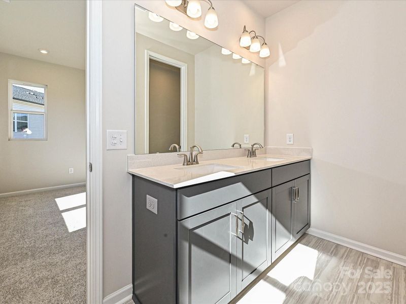 Dual Vanity at Primary Bath Provides Loads of Storage. Dual Vanity at Primary Bath Provides Loads of Storage.
