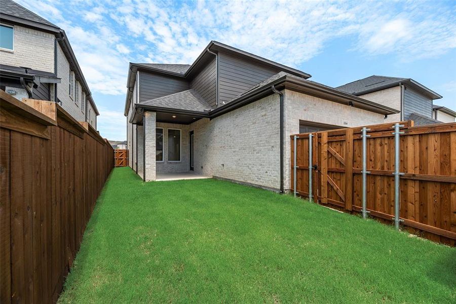 Exterior details and patio area of a home in The Grove Frisco - 40' Lots, Frisco (Image 3).
