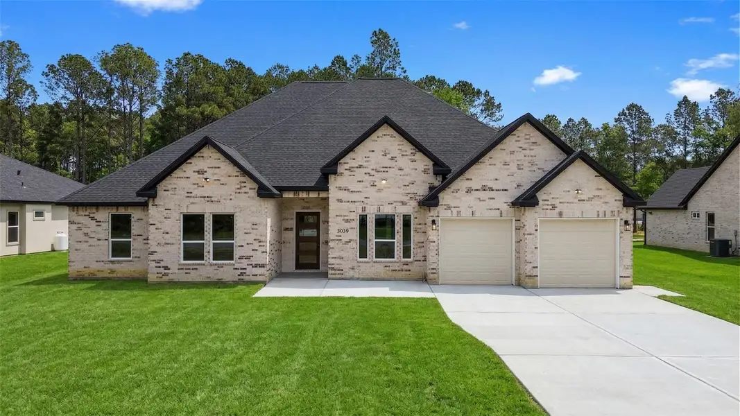 Front exterior of a new home in , Dayton, TX, highlighting curb appeal (Image 2). Front exterior of a new home in , Dayton, TX, highlighting curb appeal (Image 2).