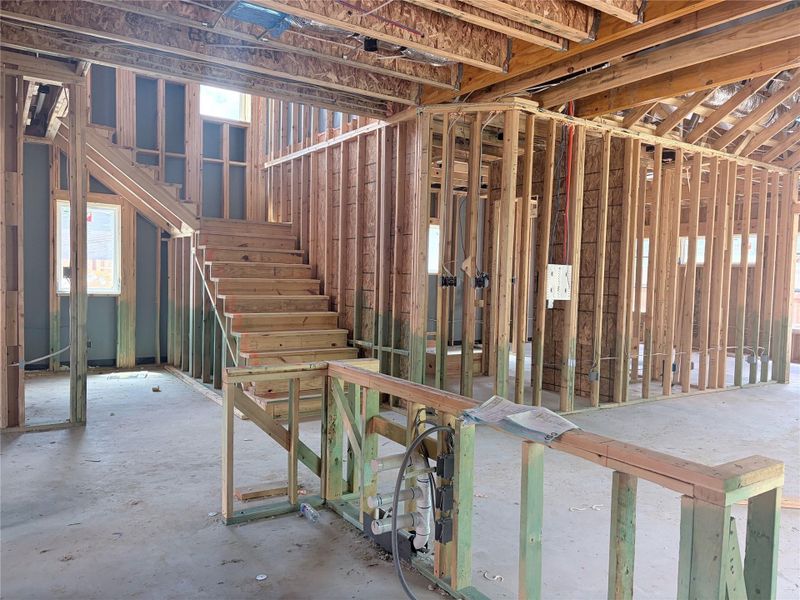 Exposed wood framing and concrete floors outline the soaring multi-level layout of this new build. Exposed wood framing and concrete floors outline the soaring multi-level layout of this new build.