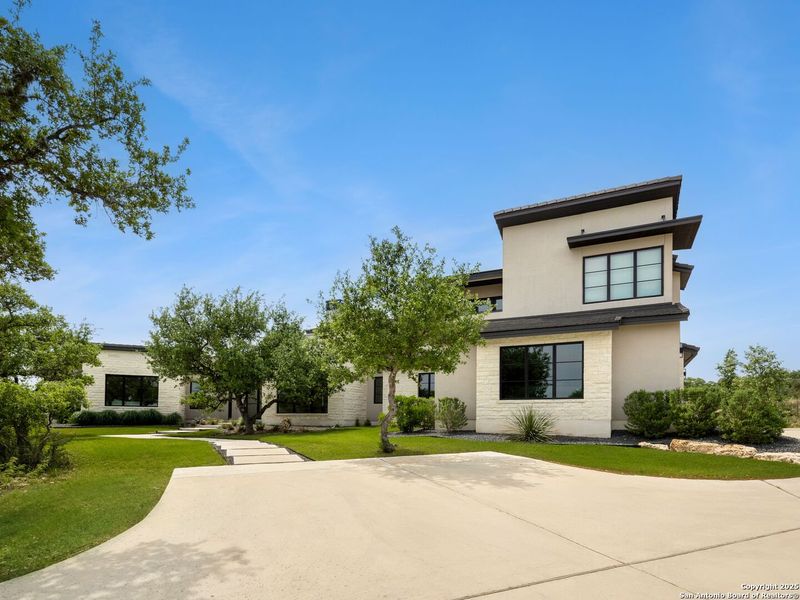 Front exterior of a new home in , Boerne, TX, highlighting curb appeal (Image 1).