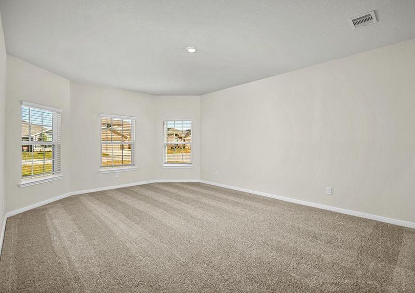 The luxurious master bedroom with plenty of natural lighting.