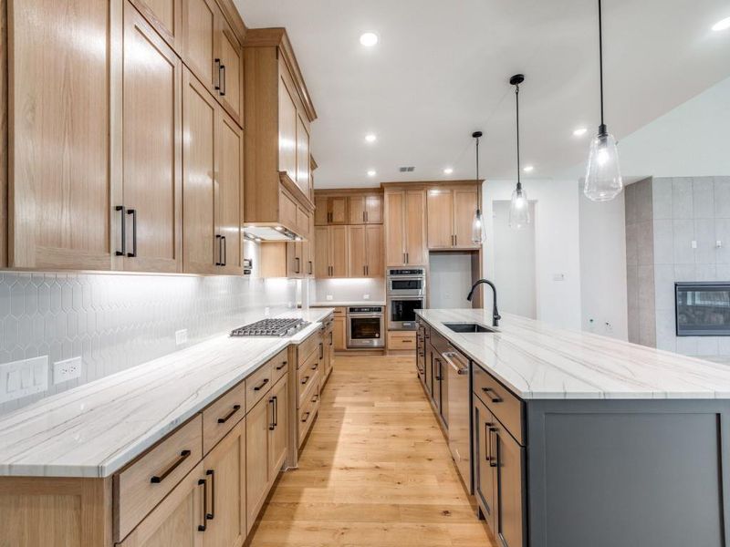 Gorgeous cabinets, plenty of prep space and top of the line appliances make this a kitchen any chef would be proud to call their own!