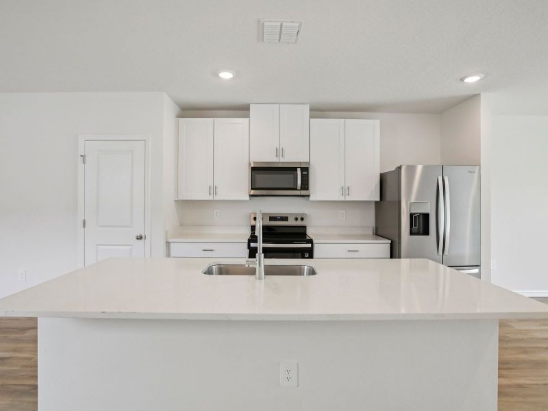 The Kitchen of the Acadia at 7521 Mia Vine Dr.