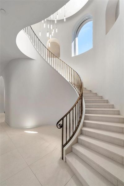 Spiral stairs with slab treads, artisan finishes