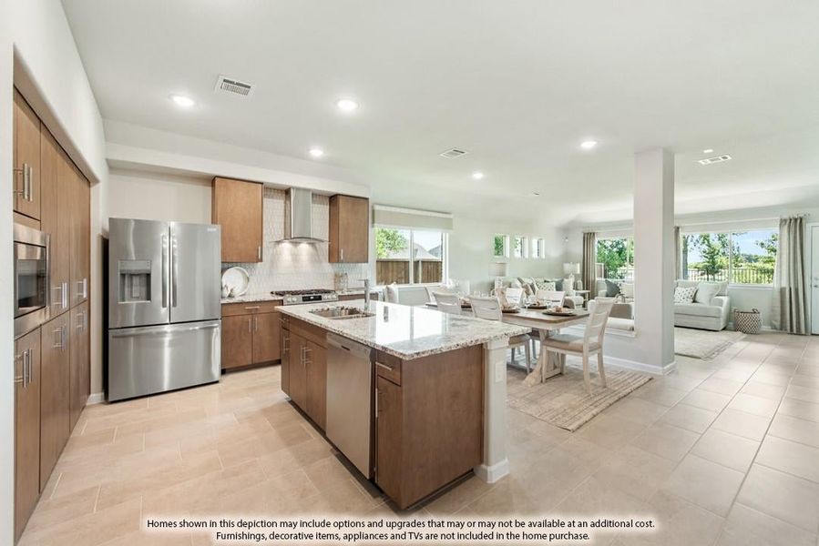 Open-concept kitchen with brown cabinets, granite island, stainless appliances, and dining area opening to living room