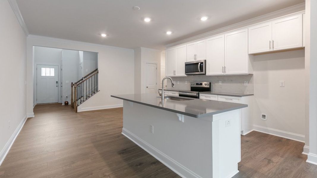 Representative furnished interior of a home built from the Savannah by D.R. Horton in The Meadows at Kinsley, Jamestown (Image 3).