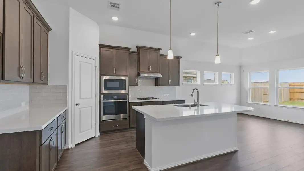 Furnished interior view inside a new home in Sunterra, Katy (Image 17).