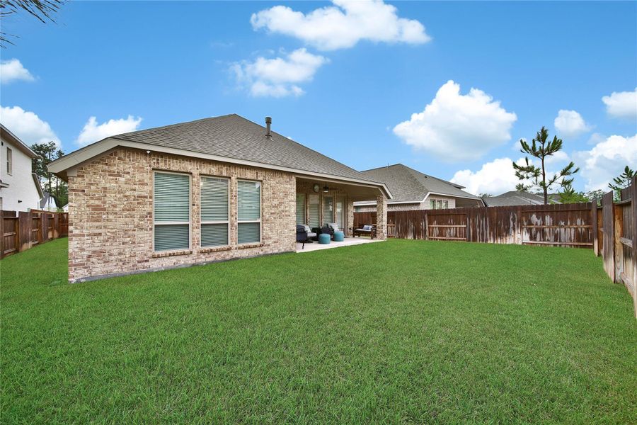 The backyard offers plenty of room for future plans—a playset, pool or your own outdoor oasis.