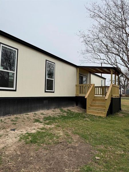 Exterior details and patio area of a home in , Pelican Bay (Image 14).