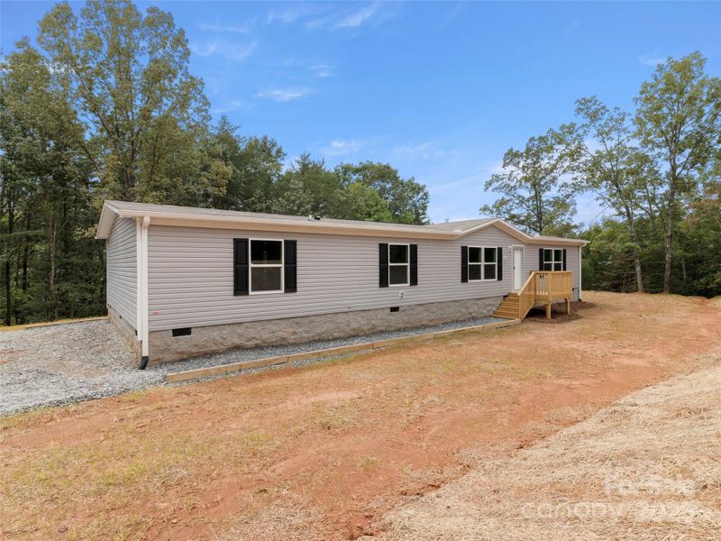 Front exterior of a new home in , Mill Spring, NC, highlighting curb appeal (Image 13). Front exterior of a new home in , Mill Spring, NC, highlighting curb appeal (Image 13).