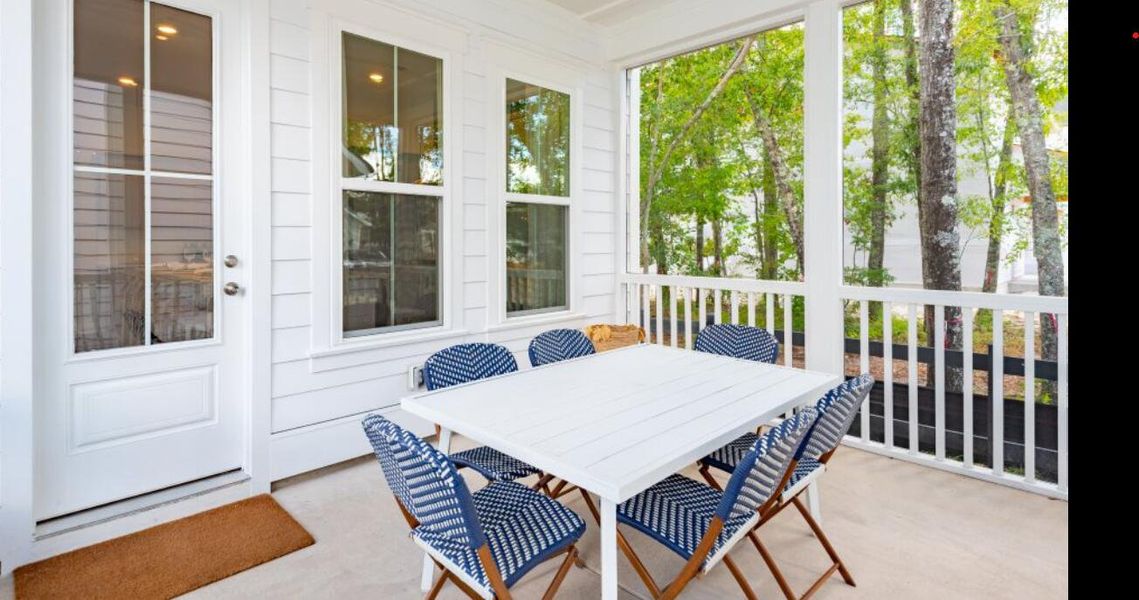 Exterior details and patio area of a home in Heron's Walk at Summers Corner: Row - Elevated Collection, Summerville (Image 2).