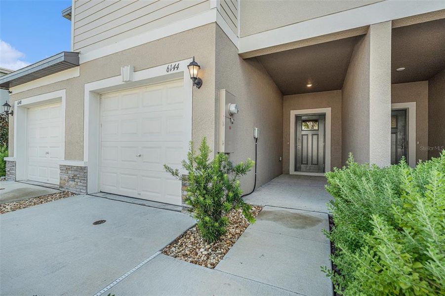 Front exterior of a new home in , Land O' Lakes, FL, highlighting curb appeal (Image 14). Front exterior of a new home in , Land O' Lakes, FL, highlighting curb appeal (Image 14).
