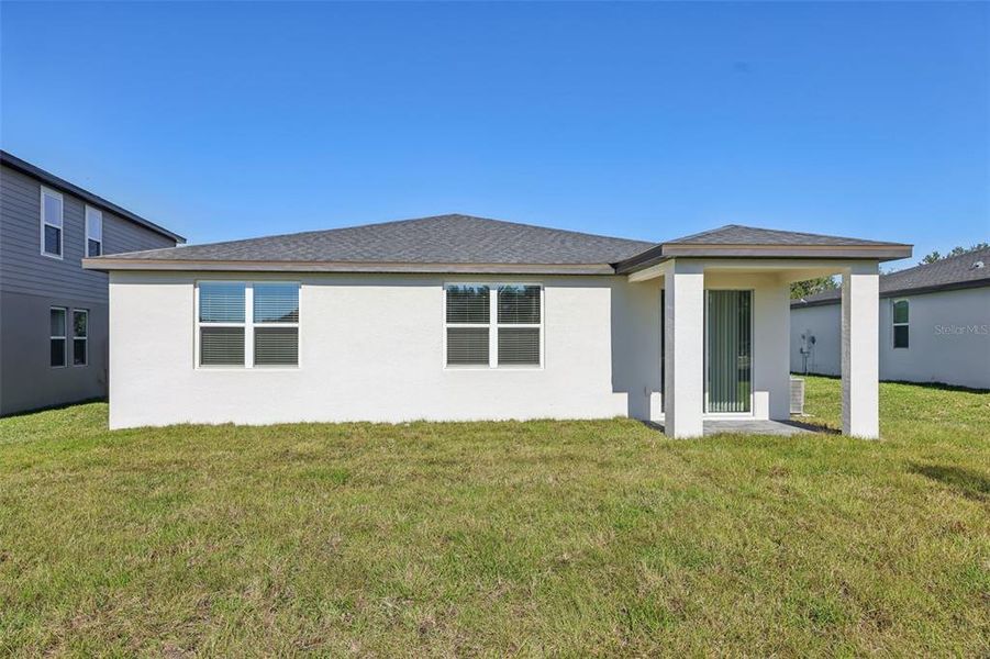 Exterior details and patio area of a home in The Reserve at Hammock Oaks - Signature Series, Lady Lake (Image 19).