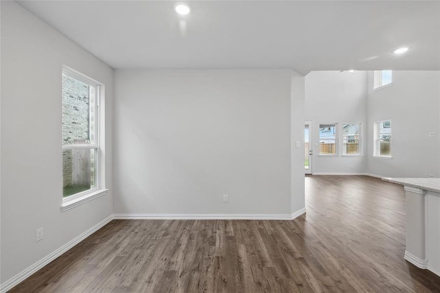 Unfurnished room featuring dark wood finished floors and recessed lighting