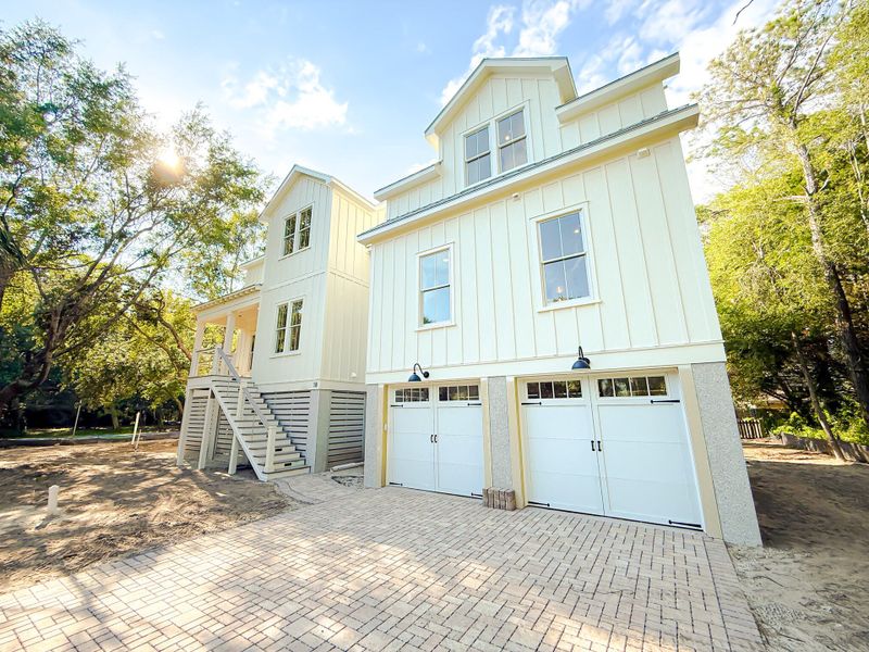 Front exterior of a new home in , Isle Of Palms, SC, highlighting curb appeal (Image 1). Front exterior of a new home in , Isle Of Palms, SC, highlighting curb appeal (Image 1).