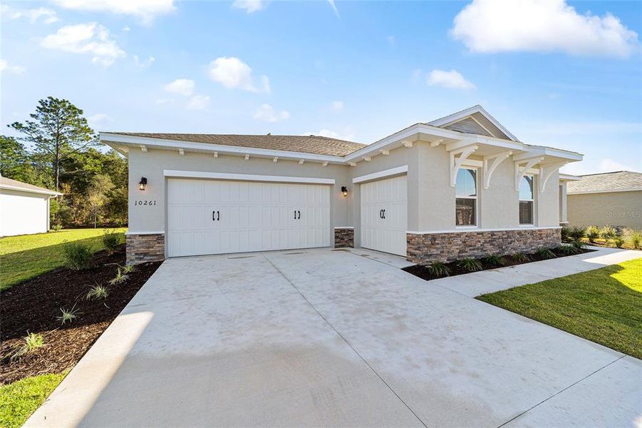 Front exterior of a new home in , Ocala, FL, highlighting curb appeal (Image 20). Front exterior of a new home in , Ocala, FL, highlighting curb appeal (Image 20).