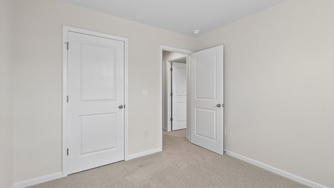 Spacious, unfurnished interior of a new home in The Townes at Honeycutt Oaks, Angier (Image 28).