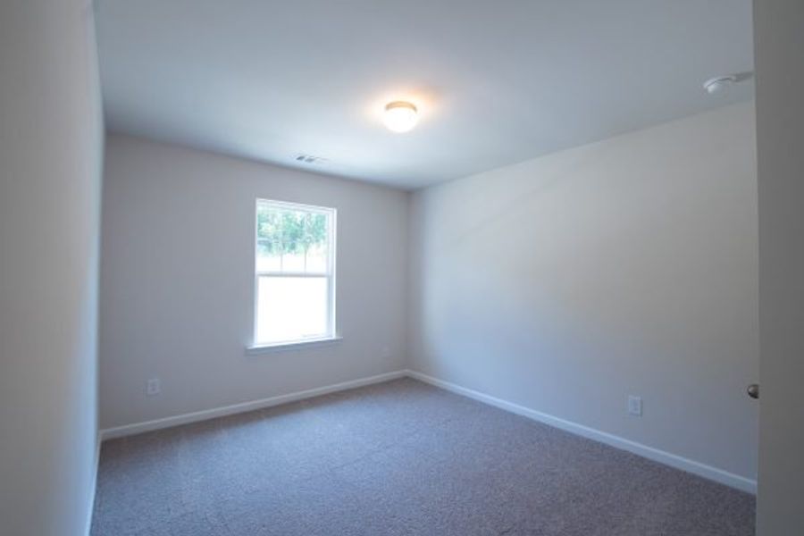 Representative unfurnished interior of a home built from the Fairfax by Piedmont Residential in Falls Creek, Flowery Branch (Image 19).