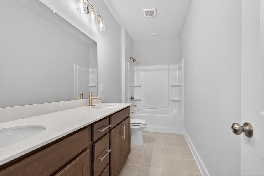 Furnished interior view inside a new home in Traditions of Braselton, Hoschton (Image 7).