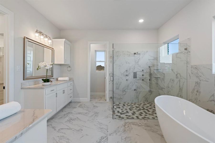 Full bathroom featuring a marble finish shower, a soaking tub, marble finish floor, vanity, and recessed lighting