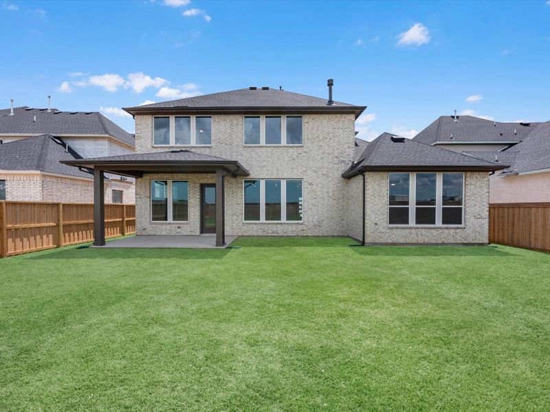 Exterior details and patio area of a home in Dunham Pointe, Cypress (Image 3).