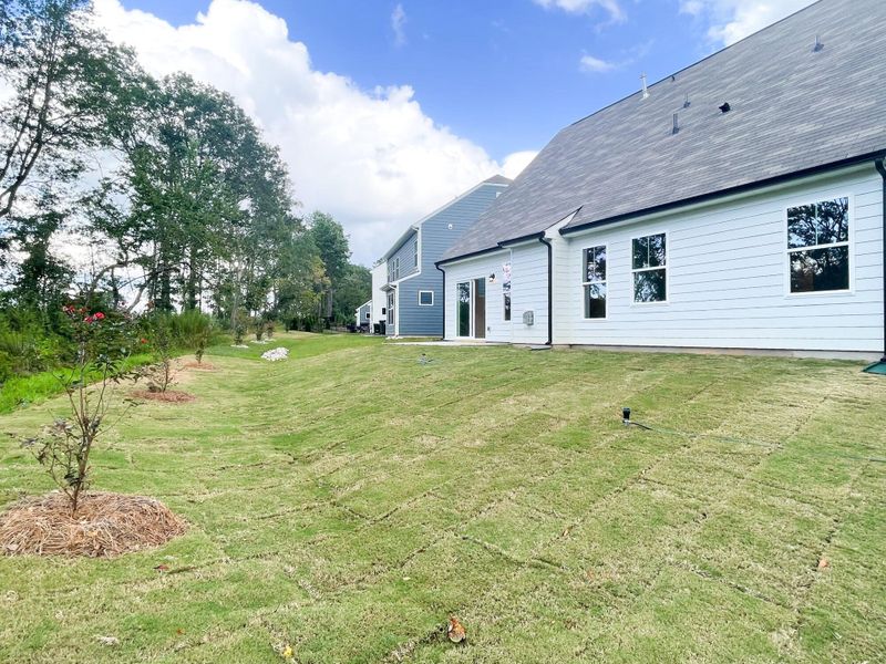 Front exterior of a new home in Greenrich Mill, Simpsonville, SC, highlighting curb appeal (Image 2). Front exterior of a new home in Greenrich Mill, Simpsonville, SC, highlighting curb appeal (Image 2).