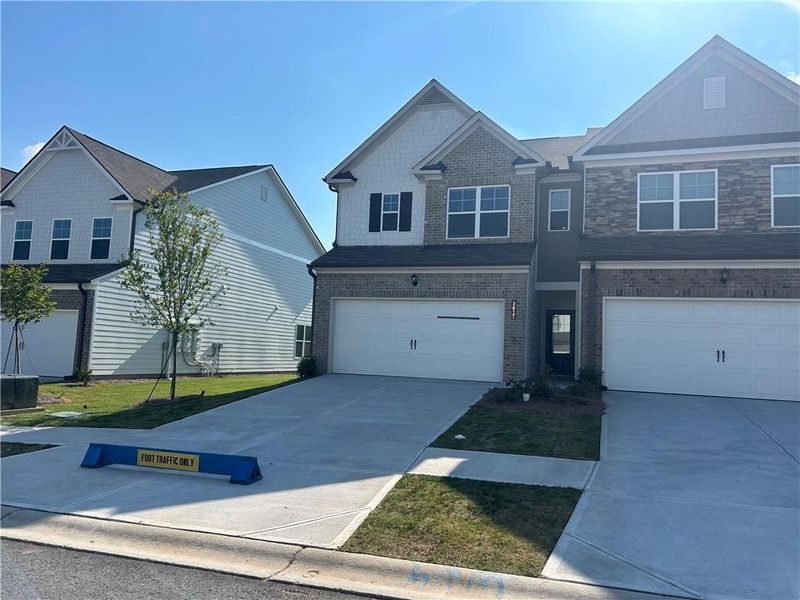 Front exterior of a new home in Somerset at Riverbrook, Gainesville, GA, highlighting curb appeal (Image 16).
