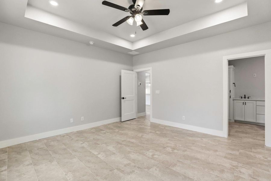 Recessed lighting illuminates this room, complemented by a contemporary ceiling fan and durable tile flooring. Recessed lighting illuminates this room, complemented by a contemporary ceiling fan and durable tile flooring.